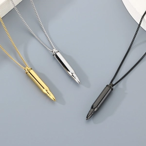 Detailed view of bullet-shaped titanium steel pendants in gold, silver, and black finishes