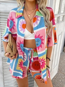 Detail of vibrant sun pattern print on colorful bohemian style shirt and shorts set