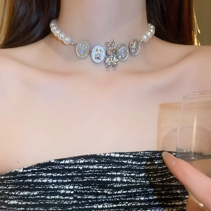 Vintage pearl choker necklace featuring silver rabbit pendants for a French chic aesthetic
