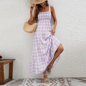 Detailed view of the elastic bodice and gingham texture on purple bohemian dress