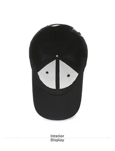 Detailed view of the internal structure and sweatband of this black cotton baseball cap