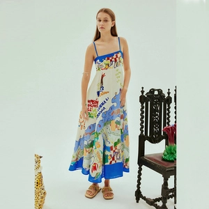 Detail of artistic graffiti print on cotton linen maxi dress with blue piping accents