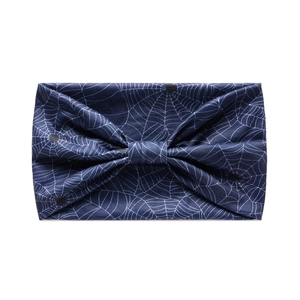 Detailed pattern of white spider webs and small spiders on a dark blue yoga headband