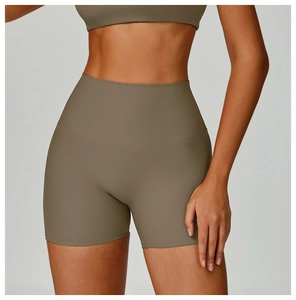 Macro detail of high-waisted ribbed fitness shorts in olive brown with seamless waistband