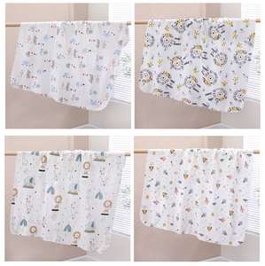 Detail of four assorted cotton muslin swaddle blankets with cute animal patterns for babies