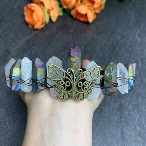 Detailed macro view of handmade crystal crown with rainbow stones and bronze butterfly