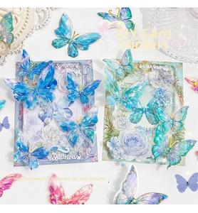 Detail of translucent laser holographic butterfly stickers with colorful metallic foil finish