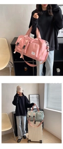 Detail of travel duffle bag featuring functional exterior pockets and shoulder strap