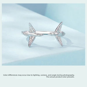 Macro shot of twin swallow birds on an adjustable S925 sterling silver open ring band