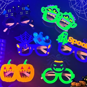 Detailed close-up of six fluorescent Halloween felt glasses including pumpkin and ghost designs