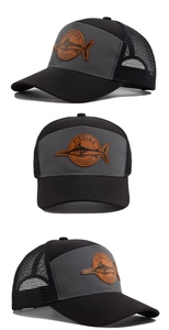 Detail of mesh trucker hat with leather shark patch and contrast color panels