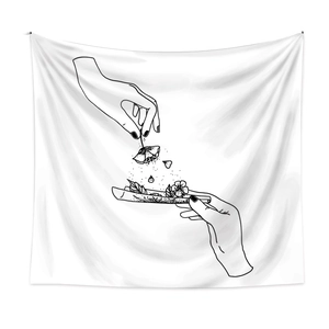 Detail of minimalist line art tapestry showing black floral hand sketches on white fabric