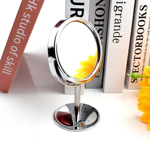 Silver round metal desktop makeup mirror with rotating double-sided 1:2 magnification