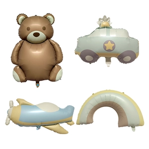 Detail view of matte foil balloons featuring cute bear, airplane, car and rainbow shapes