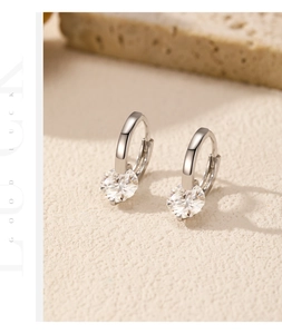 Macro detail of silver S925 sterling silver hoop earrings with 1 carat moissanite stones