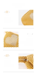 Detail einer goldenen Abendtasche mit weißen Strassmustern und edlem Metallverschluss