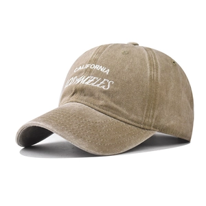 Detail of white California Los Angeles embroidery on washed cotton baseball cap