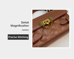 Detail magnification of brown quilted leather bag with elegant golden U-shaped metal buckle