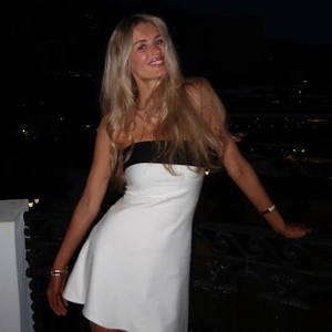 Detail of color-block strapless bodycon mini dress with black and white contrast design