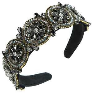 Close-up of vintage baroque headband with hand-stitched crystals and gold bead embroidery