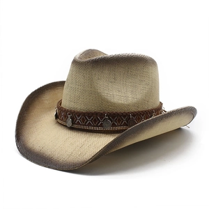 Detail of hand-woven straw cowboy hat featuring ethnic pattern band and vintage coins