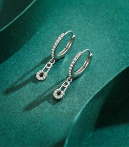 Detail of s925 sterling silver safety pin earring with micro-set white zircon stones