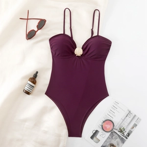 Slim fit deep purple one-piece swimsuit with golden scallop accessory and thin straps