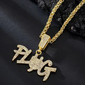 Hip hop gold necklace with iced out FUG letter pendant on black stone background