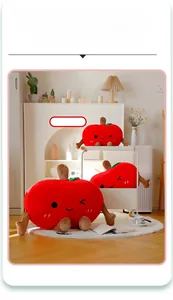 Three sizes of red apple plush pillows 35cm 55cm and 75cm displayed in a cozy home setting