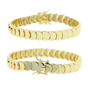 Detail view of two gold crescent-link necklaces showing polished texture and secure clasp