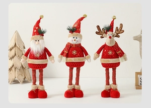 Detailed trio of Christmas plush dolls featuring red gold embroidery and long legs