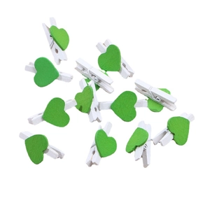Mini white wooden photo clips with green decorative hearts for creative home decor