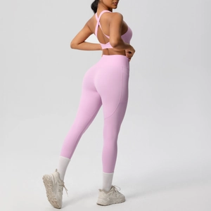 Detail view of pink-purple yoga set with racerback bra and high-waist side pocket leggings