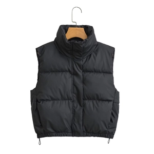 Detail of black stand collar quilted puffer vest with adjustable drawstring hem on hanger