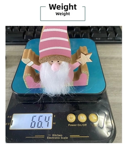 Detailed weight measurement showing 66.4g for pink wooden Christmas gnome decoration