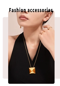Golden geometric jewelry set featuring a 3D triangle pendant necklace and earrings