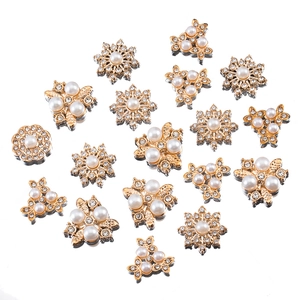 Floral pearls and sparkling rhinestones on golden metal bases for DIY jewelry and hair clips