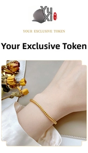 Detail shot of delicate gold wheat chain braided bracelet on wrist with elegant floral background