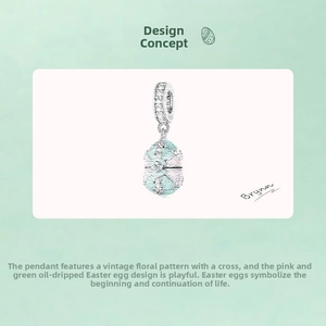 Detail of opening Easter egg charm with green enamel finish and vintage cross pattern