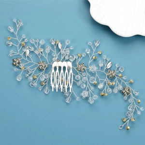 Detail view of silver bridal hair comb with crystal beads and intricate branch design