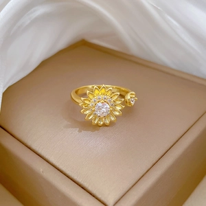 Elegant gold sunflower open ring with cubic zirconia in a premium jewelry box