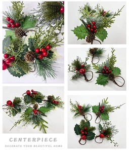 Detailed view of Christmas napkin rings with pine needles, red berries and pine cones