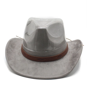 Detail of gray felt cowboy hat with embossed brown decorative band and creased crown
