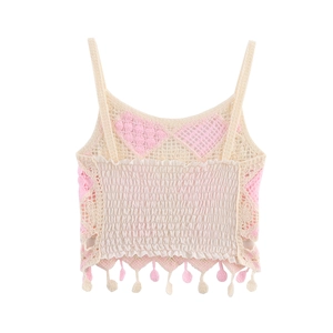Detailed knit texture of pink and beige crochet camisole with elastic pleated back