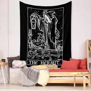 Detail showing The Hermit tarot tapestry as a black and white wall decor in a bedroom