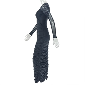 Detail of ruched black midi dress showing sheer mesh long sleeves and pleated texture