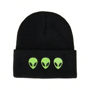 Trendy black knit beanie featuring three neon green alien embroidery on folded cuff