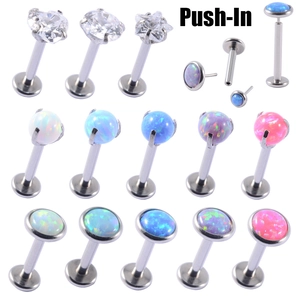 Macro detail of G23 titanium push-in body jewelry set with multi-color opal and zircon stones