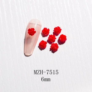 Close-up of 6mm red 3D resin rose flower charms for nail art and DIY decoration