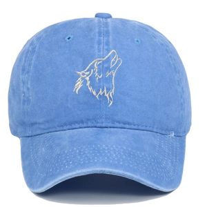 Close-up of wolf head embroidery on blue washed cotton vintage baseball cap